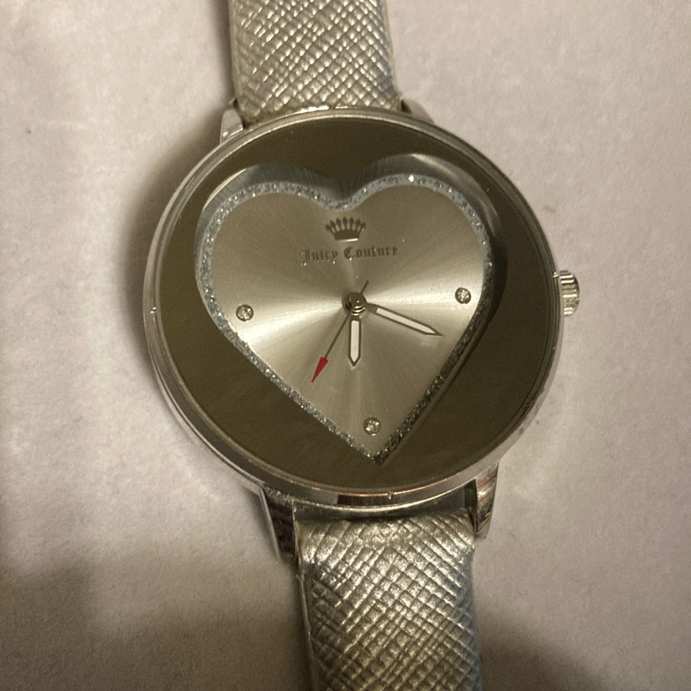 Juicy couture silver heart face watch with shiny stones . Minor wear